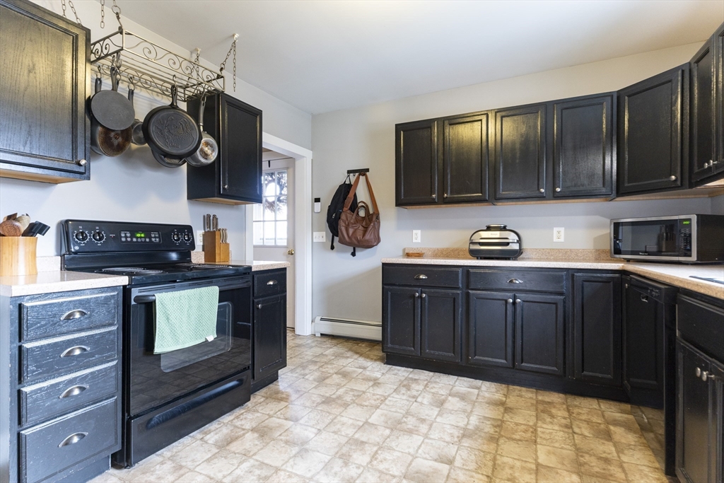 68 D Street Athol, MA 01331 - Photo 4 of 35 a kitchen with stainless steel appliances granite countertop a stove a sink and a microwave