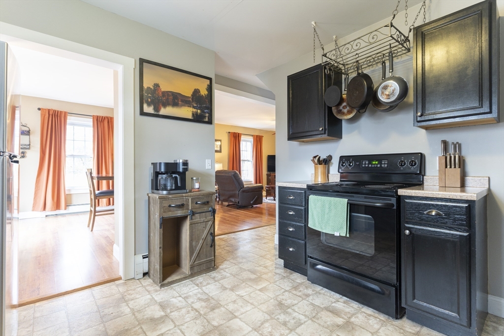 68 D Street Athol, MA 01331 - Photo 7 of 35 a kitchen with stainless steel appliances granite countertop a stove a sink and a microwave