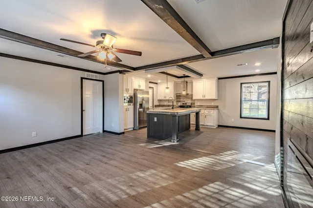a view of a kitchen with a sink cabinets and window