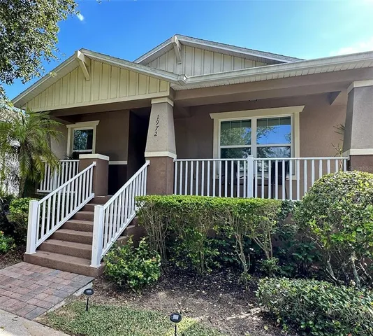 a view of a house with garden and deck