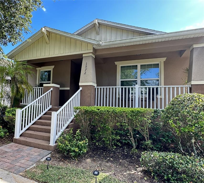 a view of a house with garden and deck