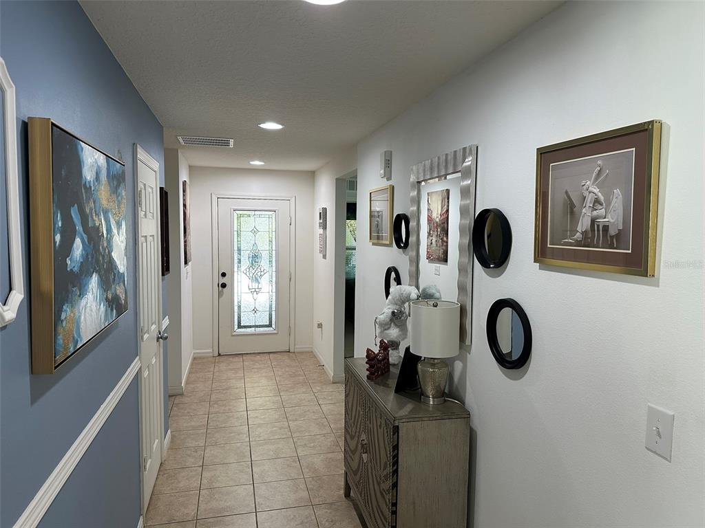 Undisclosed Address Tavares, FL 32778 - Photo 20 of 29 a bathroom with a shower and mirror