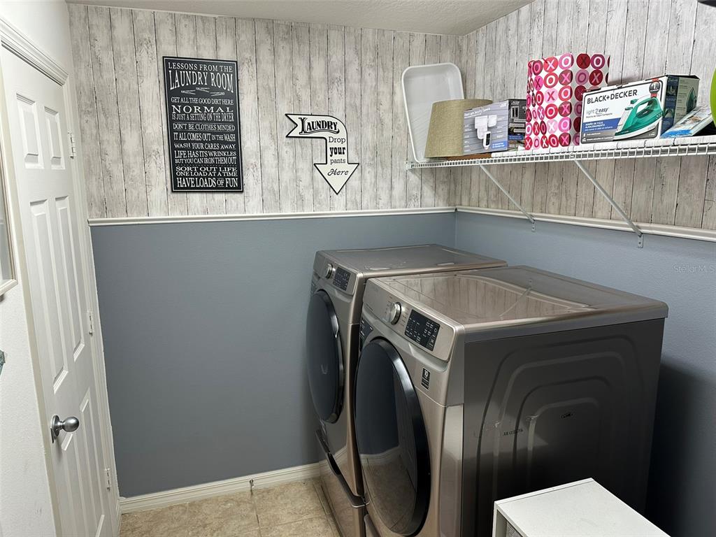 Undisclosed Address Tavares, FL 32778 - Photo 8 of 29 a utility room with dryer and washer