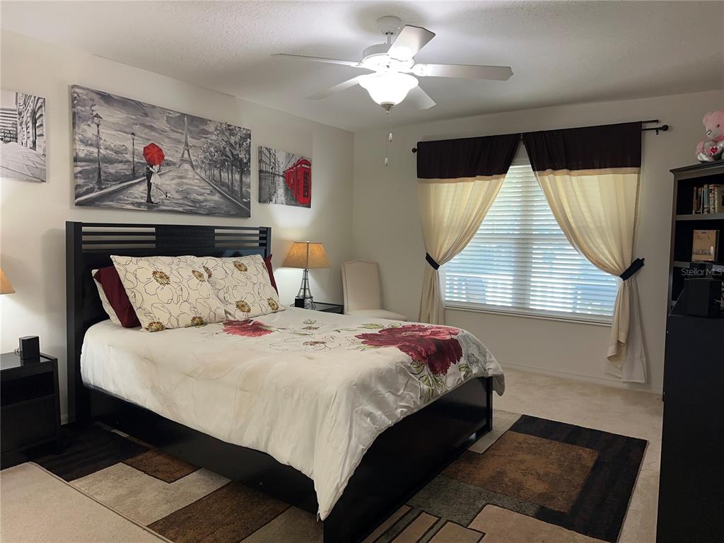 Undisclosed Address Tavares, FL 32778 - Photo 10 of 29 a bedroom with bed and a window