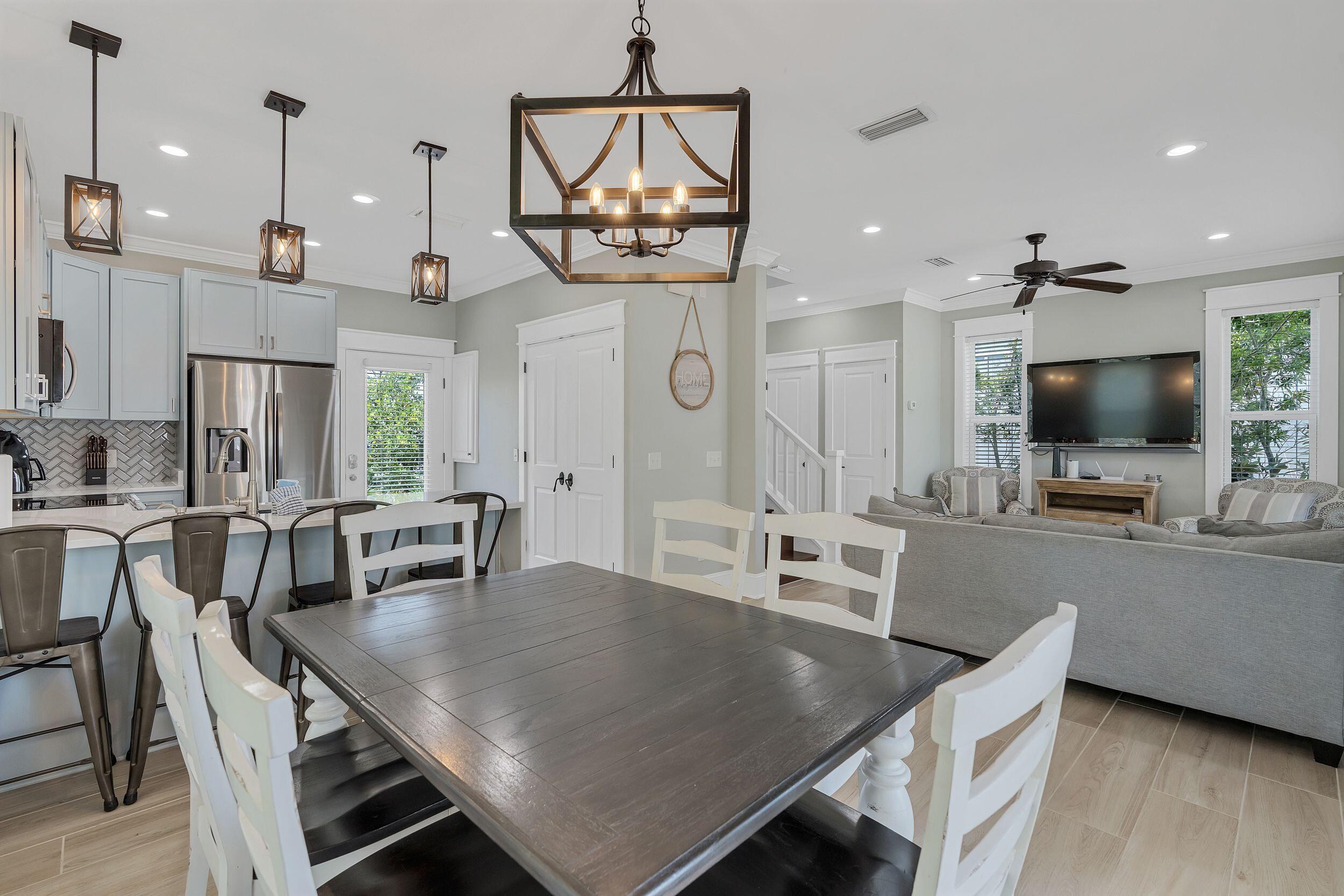 45 Abbey Road Santa Rosa Beach, FL 32459 - Photo 16 of 34 a view of a dining room with furniture window and wooden floor