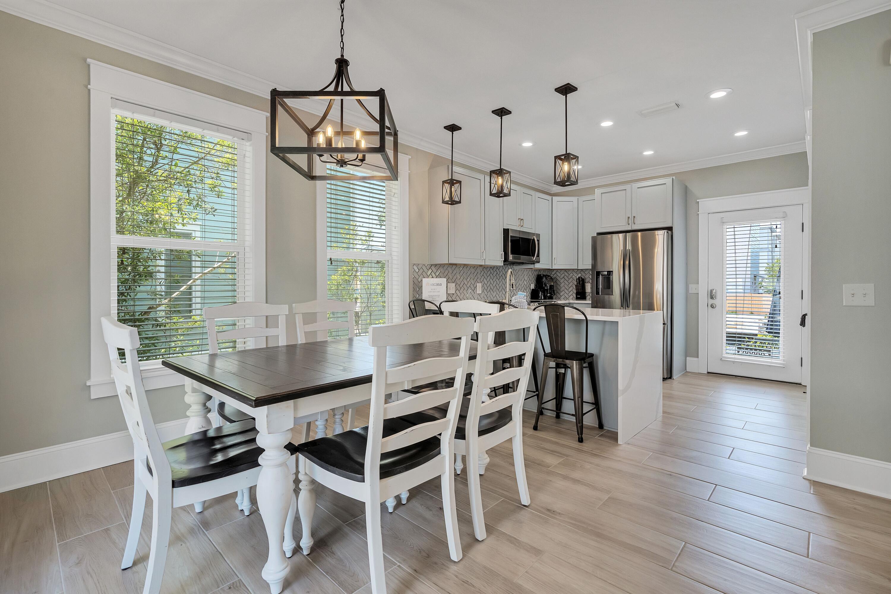 45 Abbey Road Santa Rosa Beach, FL 32459 - Photo 17 of 34 a view of a dining room with furniture window and wooden floor