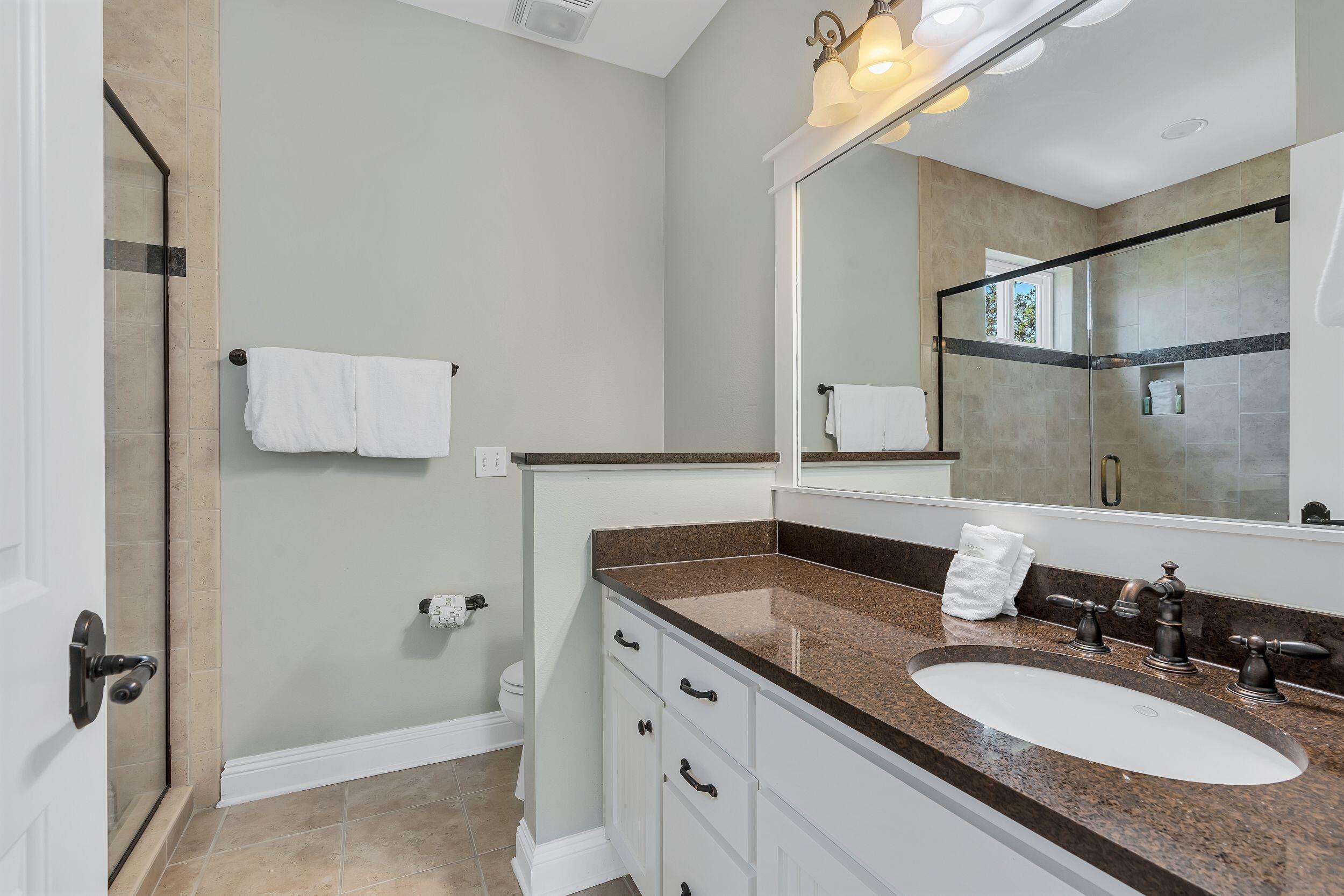 45 Abbey Road Santa Rosa Beach, FL 32459 - Photo 20 of 34 a bathroom with a granite countertop sink and a mirror