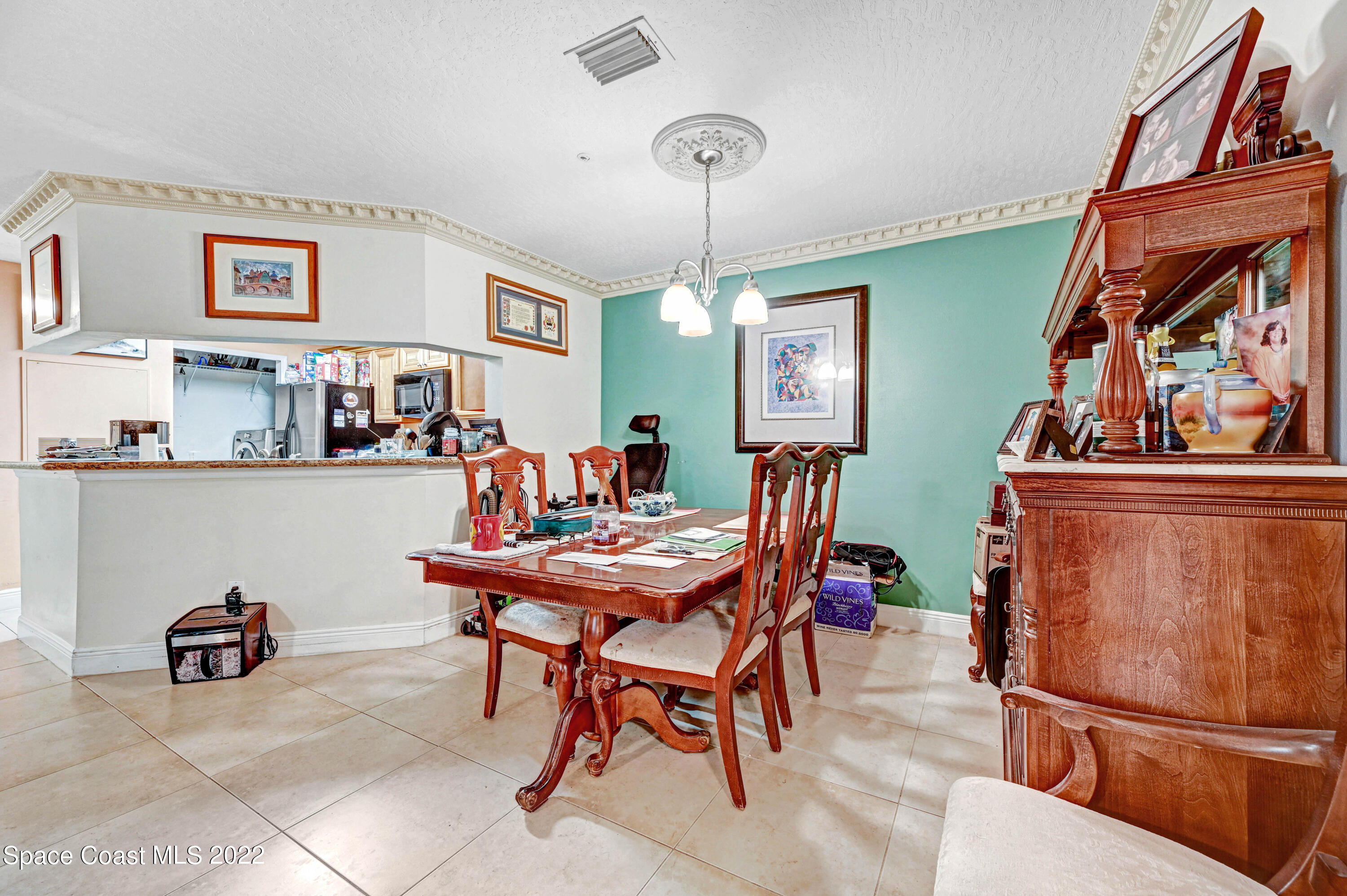 7667 North Wickham Road, Unit 107 Melbourne, FL 32940 - Photo 12 of 26 a view of a dining room with furniture