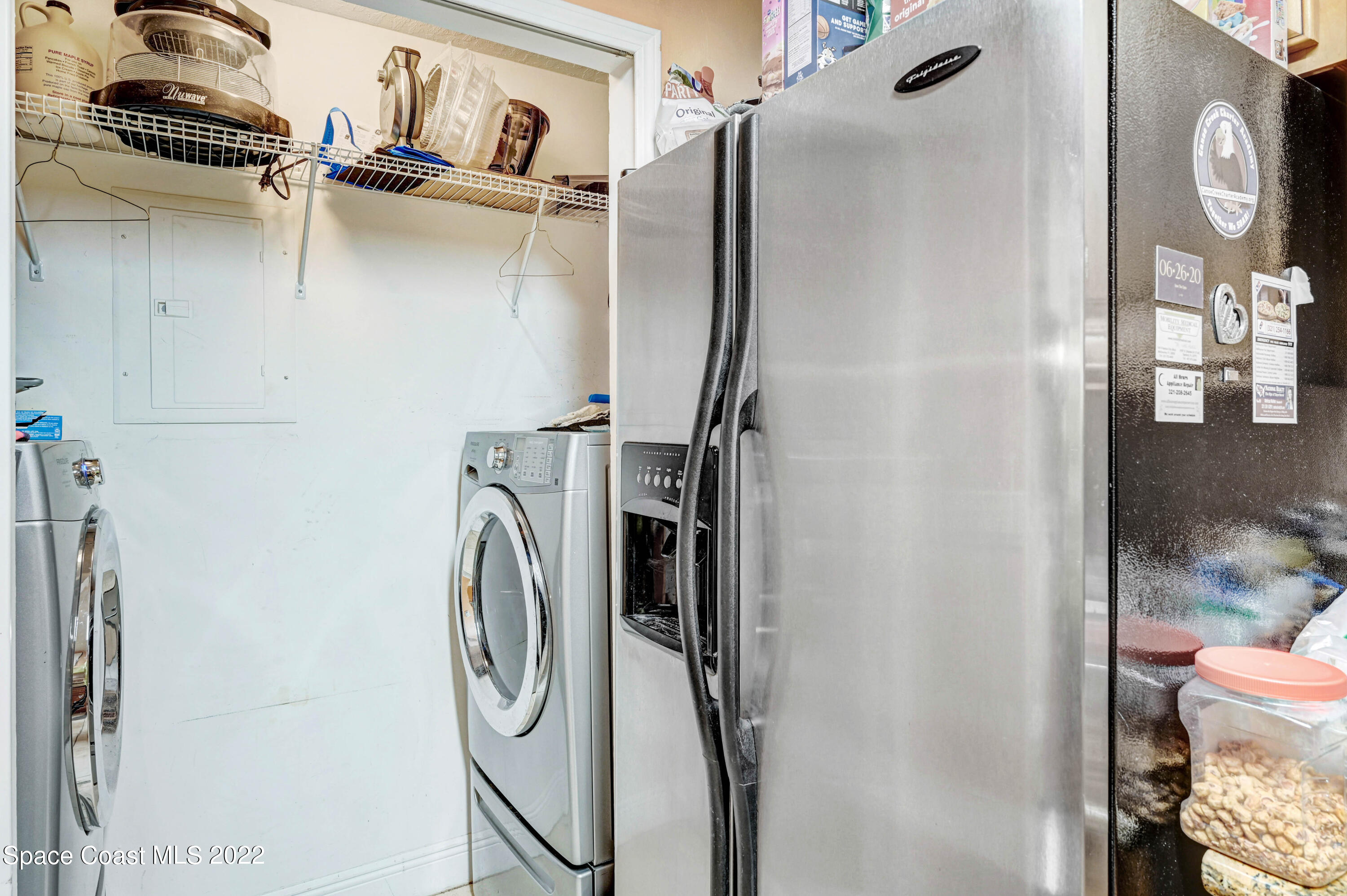 7667 North Wickham Road, Unit 107 Melbourne, FL 32940 - Photo 13 of 26 a utility room with dryer and washer