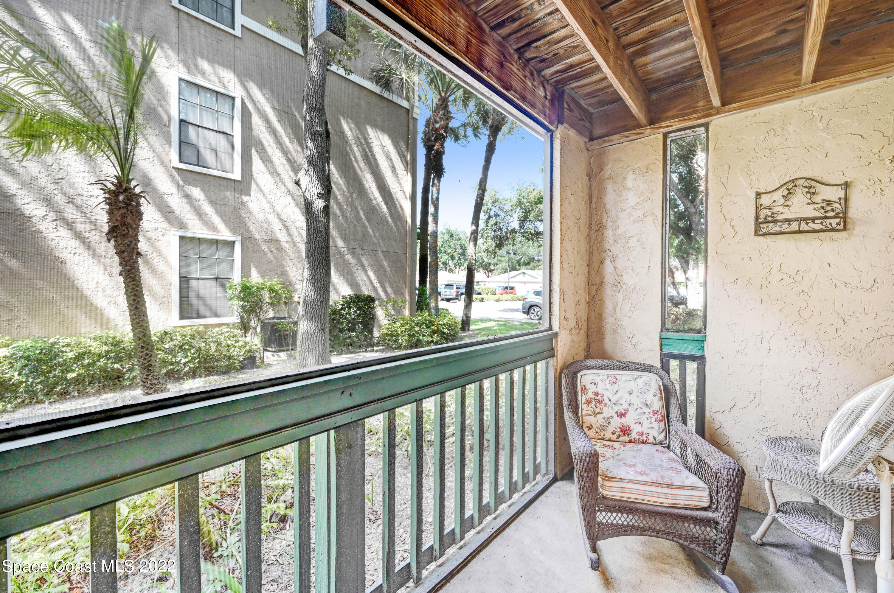 7667 North Wickham Road, Unit 107 Melbourne, FL 32940 - Photo 20 of 26 a view of a porch with furniture