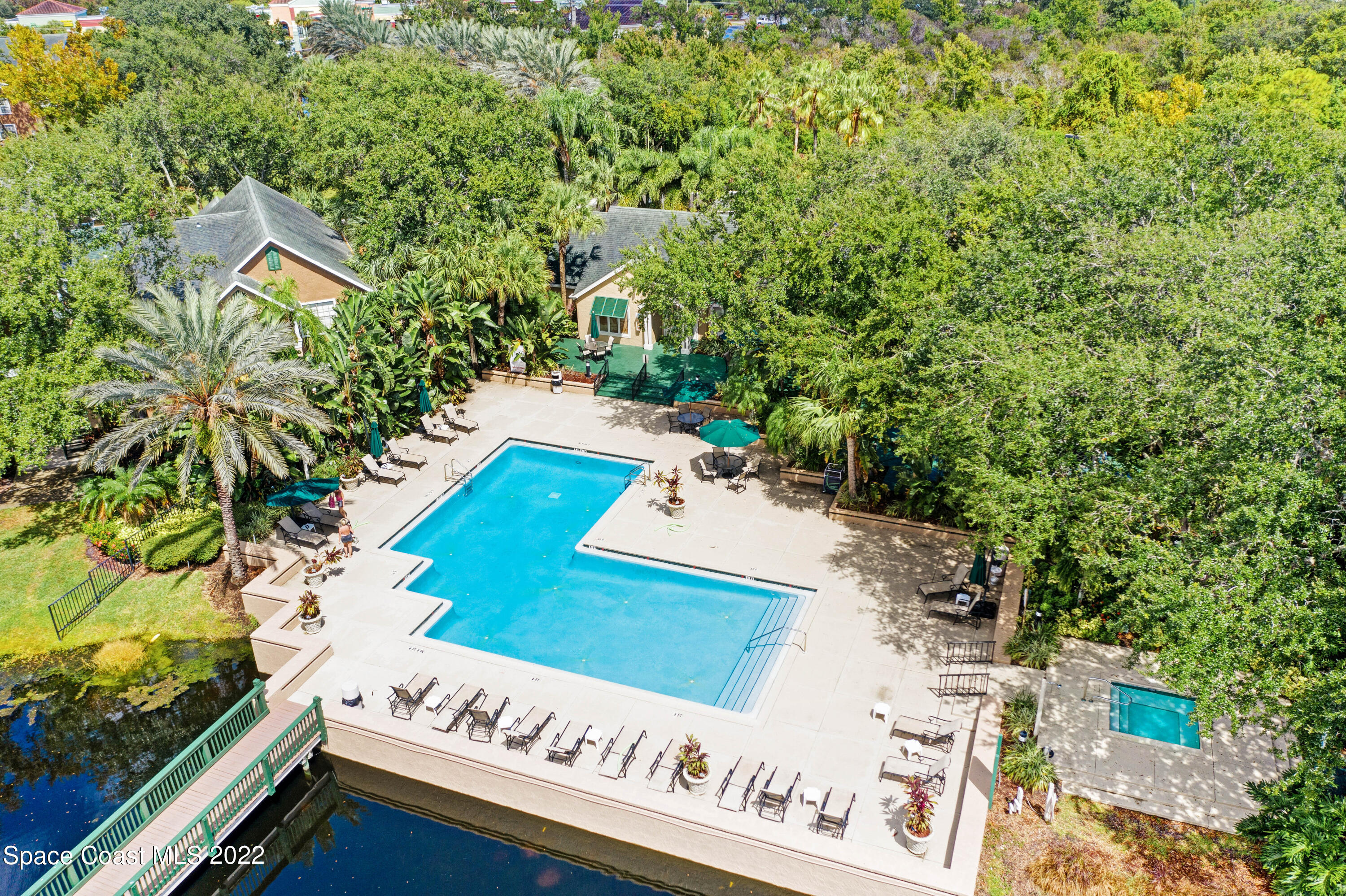 7667 North Wickham Road, Unit 107 Melbourne, FL 32940 - Photo 23 of 26 a view of a yard with an outdoor space