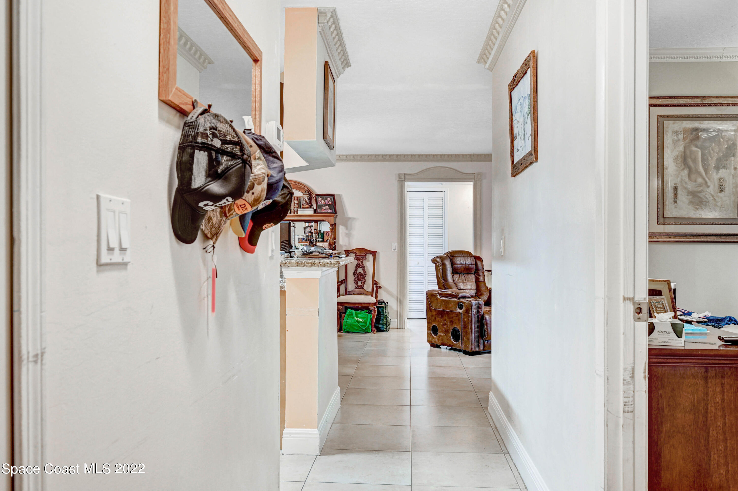 7667 North Wickham Road, Unit 107 Melbourne, FL 32940 - Photo 4 of 26 a view of walk in closet with clothes and shoes