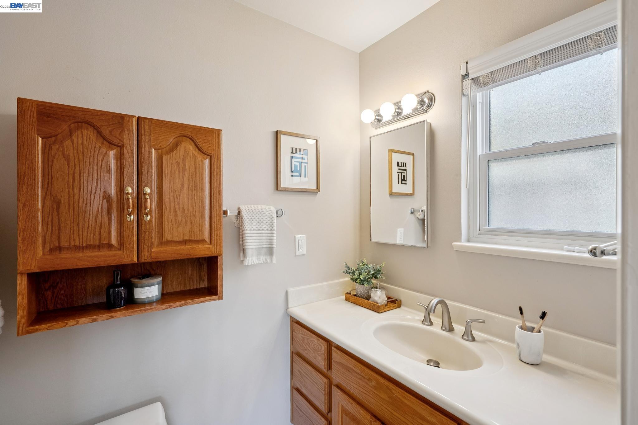328 Sand Beach Road Alameda, CA 94501 - Photo 28 of 48 a bathroom with a sink double vanity and a mirror