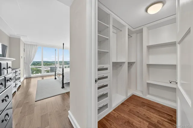 a bedroom with a bed and a night stand