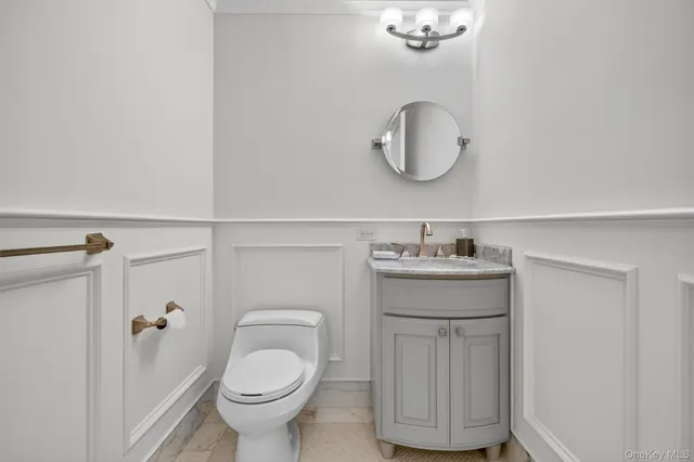 a view of a hallway with wooden floor and closet