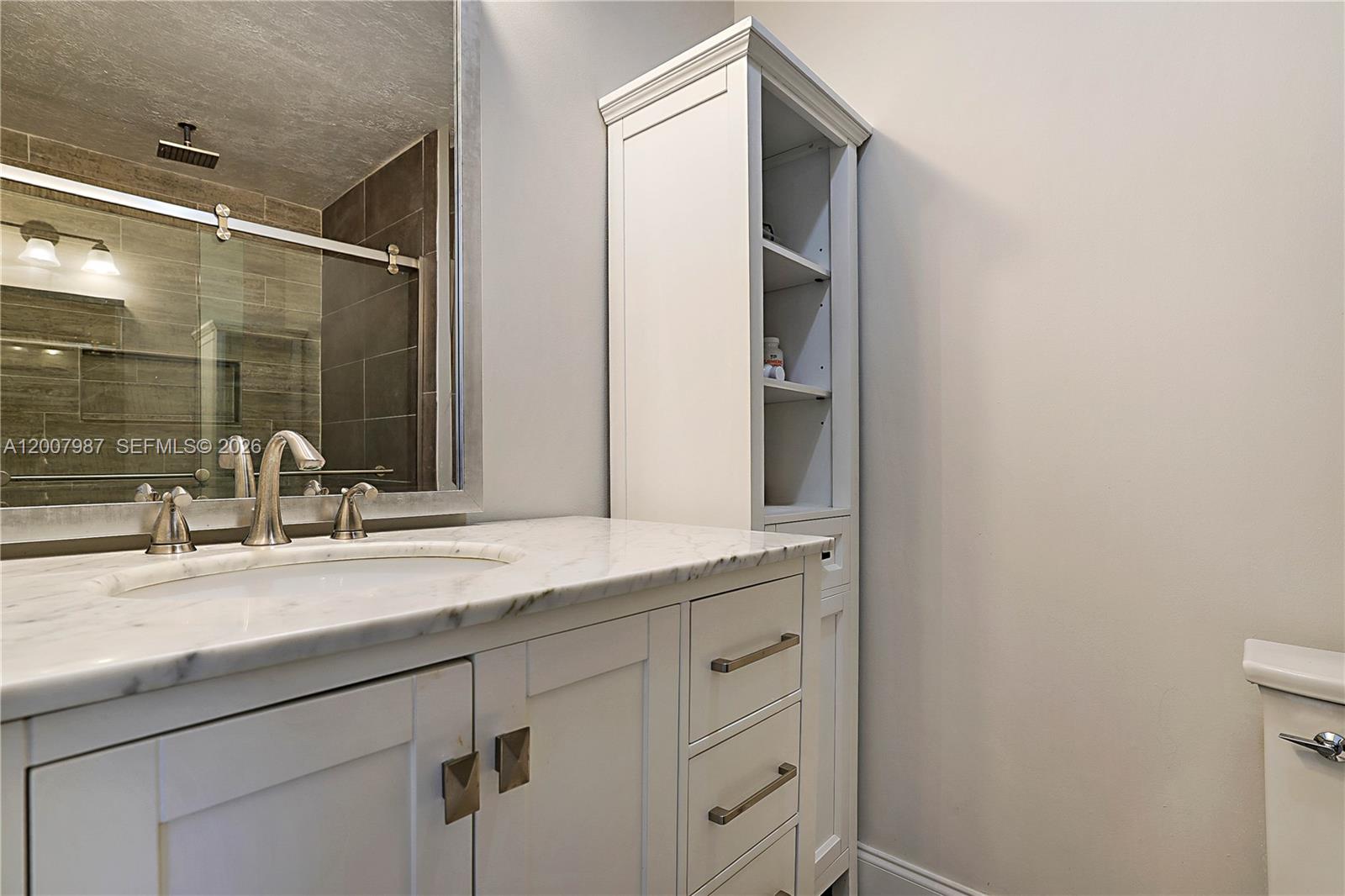 9169 Southeast Riverfront Terrace, Unit M Jupiter, FL 33469 - Photo 22 of 37 Redone Bathrooms