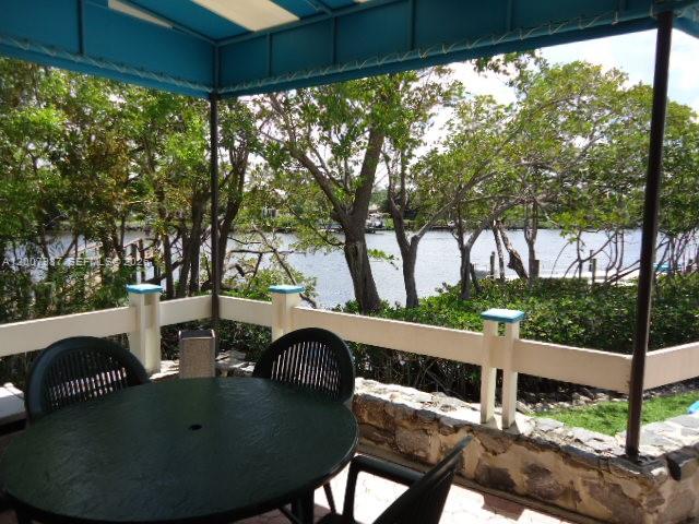 9169 Southeast Riverfront Terrace, Unit M Jupiter, FL 33469 - Photo 30 of 37 BBQ area to dine along the river