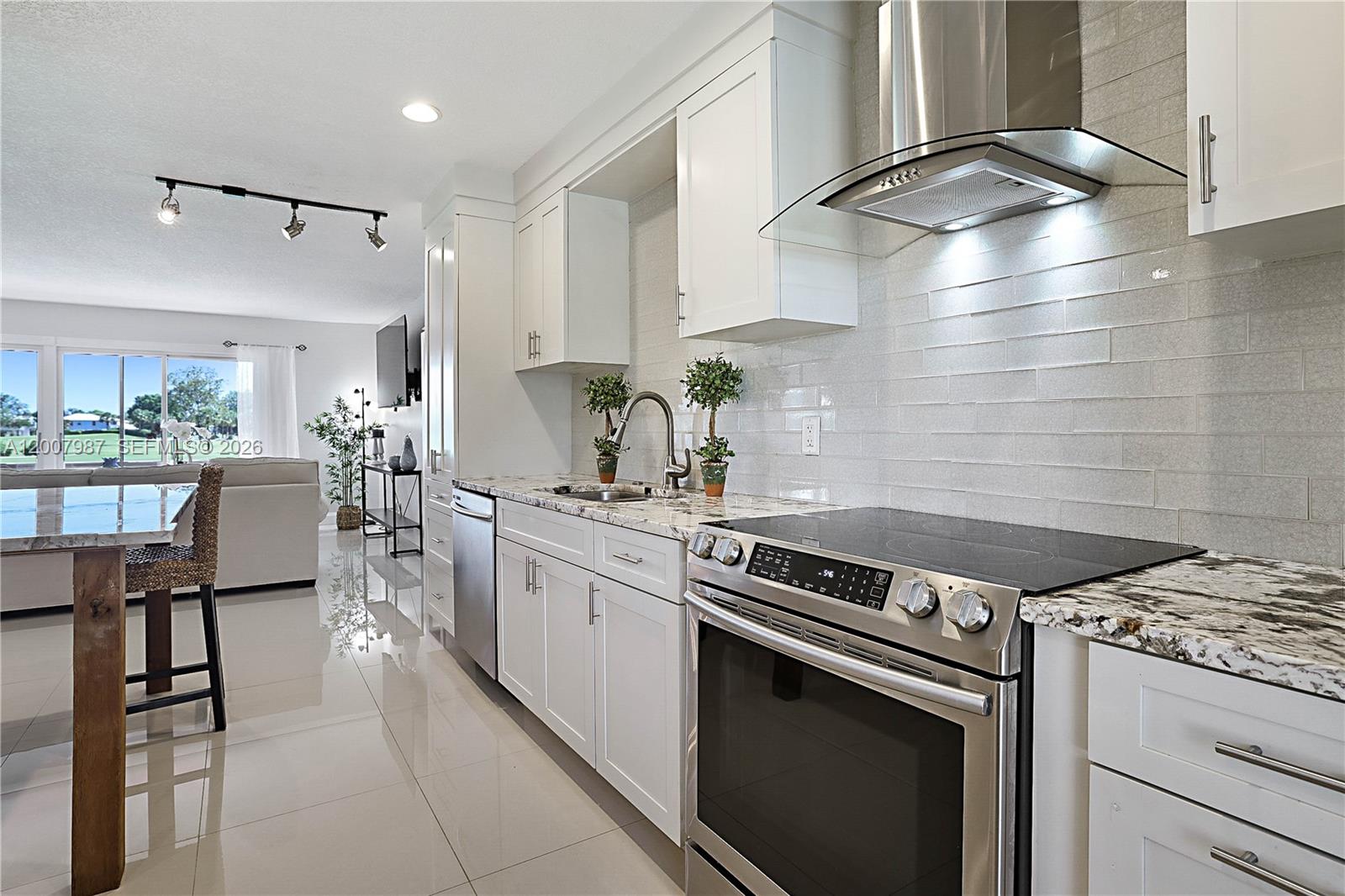 9169 Southeast Riverfront Terrace, Unit M Jupiter, FL 33469 - Photo 3 of 37 Redone modern kitchen