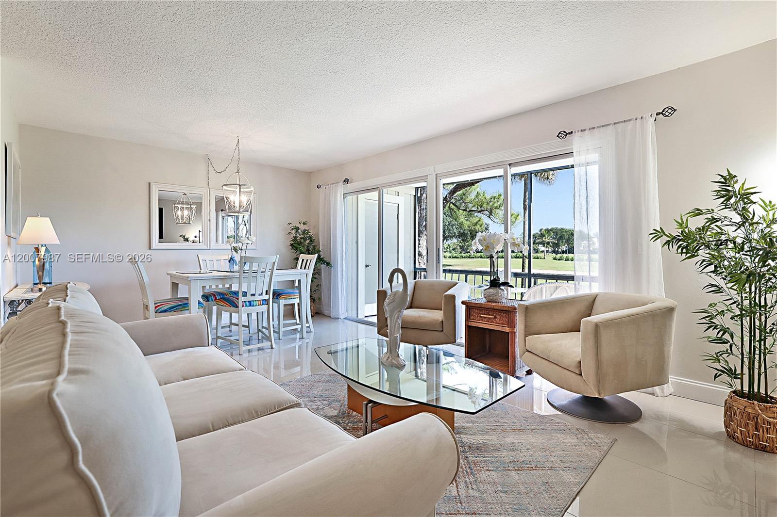 9169 Southeast Riverfront Terrace, Unit M Jupiter, FL 33469 - Photo 6 of 37 Large porcelain tiles clean and modern look to this condo
