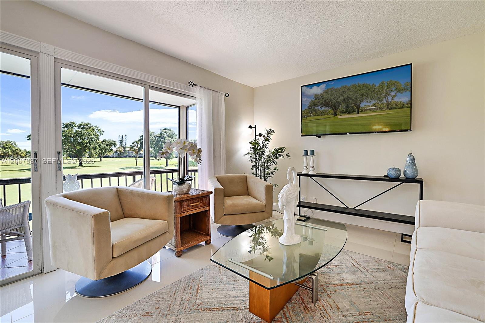 9169 Southeast Riverfront Terrace, Unit M Jupiter, FL 33469 - Photo 7 of 37 Large living area that opens to balcony