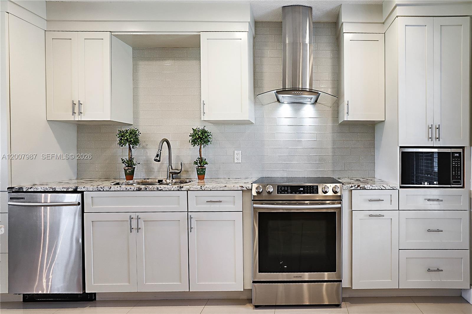 9169 Southeast Riverfront Terrace, Unit M Jupiter, FL 33469 - Photo 10 of 37 Custom kitchen , SS Appliances, Shaker wood cabinets.