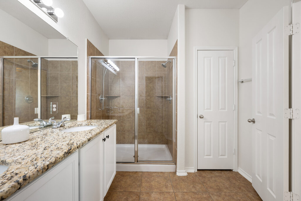 11744 Easy Street Austin, TX 78748 - Photo 32 of 40 Polished granite countertops and a spacious tile shower highlight this functional bathroom design.