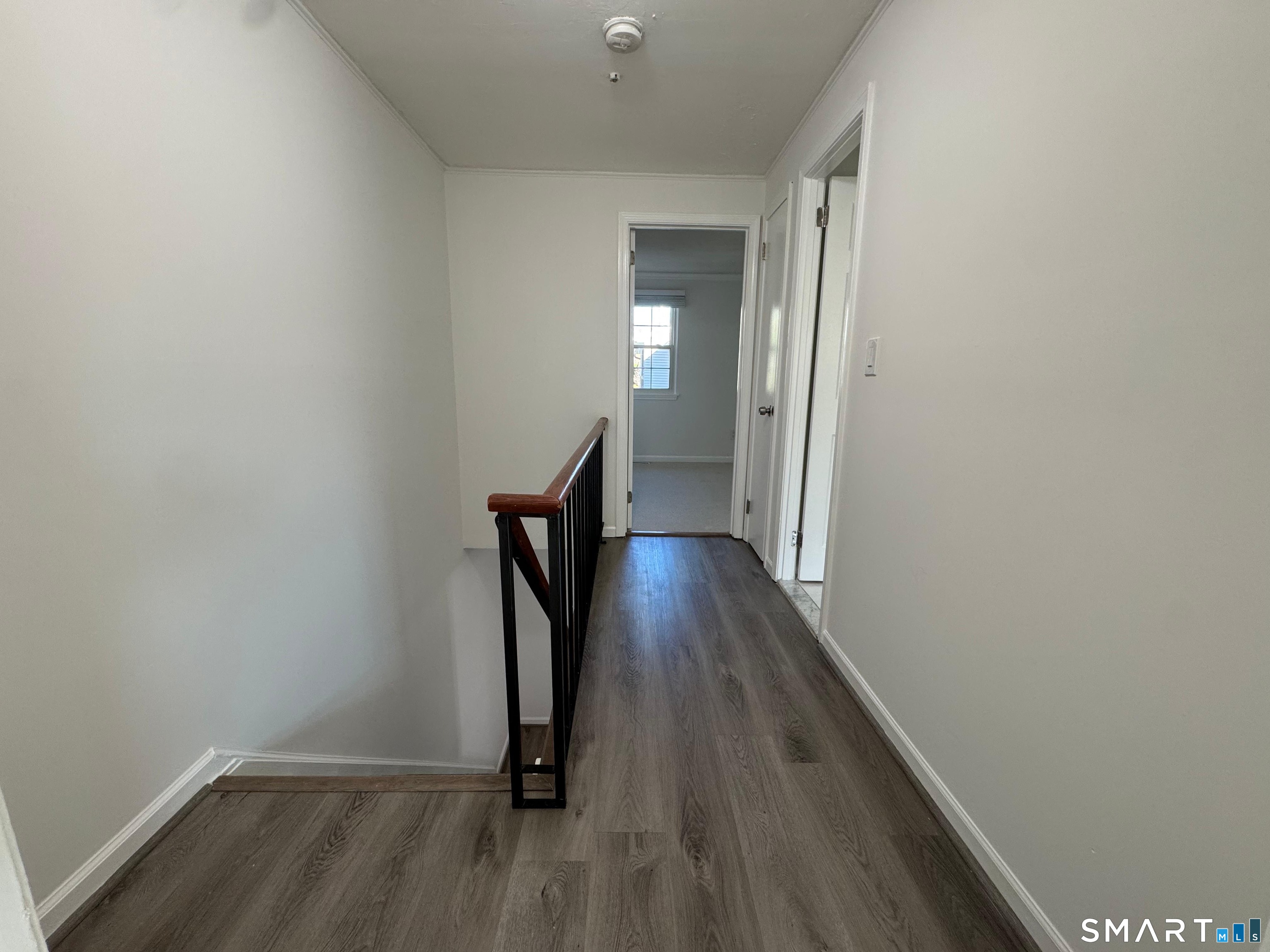 88 East Gate Lane, Unit 88 Hamden, CT 06514 - Photo 22 of 62 a view of a hallway with wooden floor and staircase