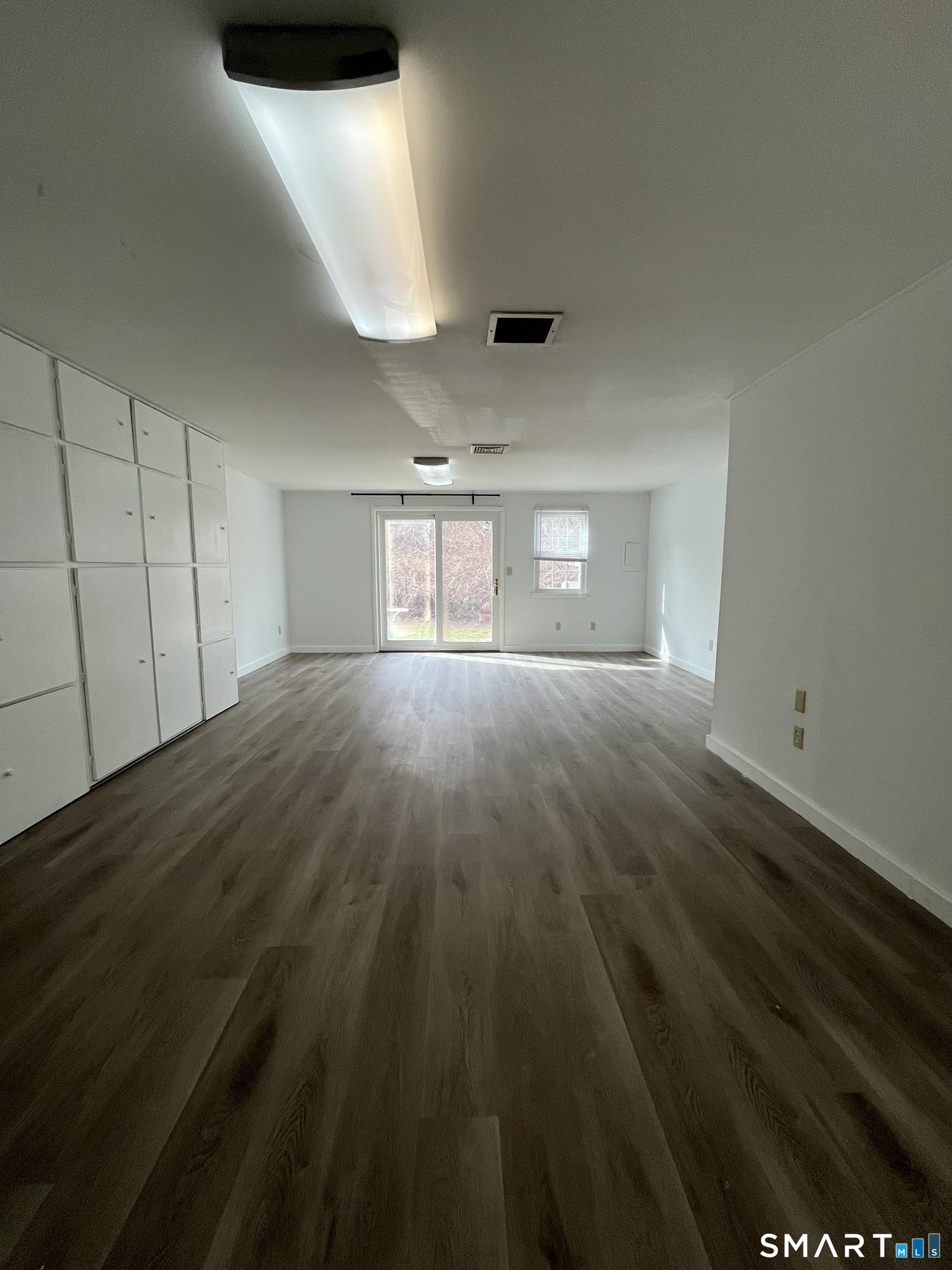 88 East Gate Lane, Unit 88 Hamden, CT 06514 - Photo 24 of 62 wooden floor in an empty room with a window