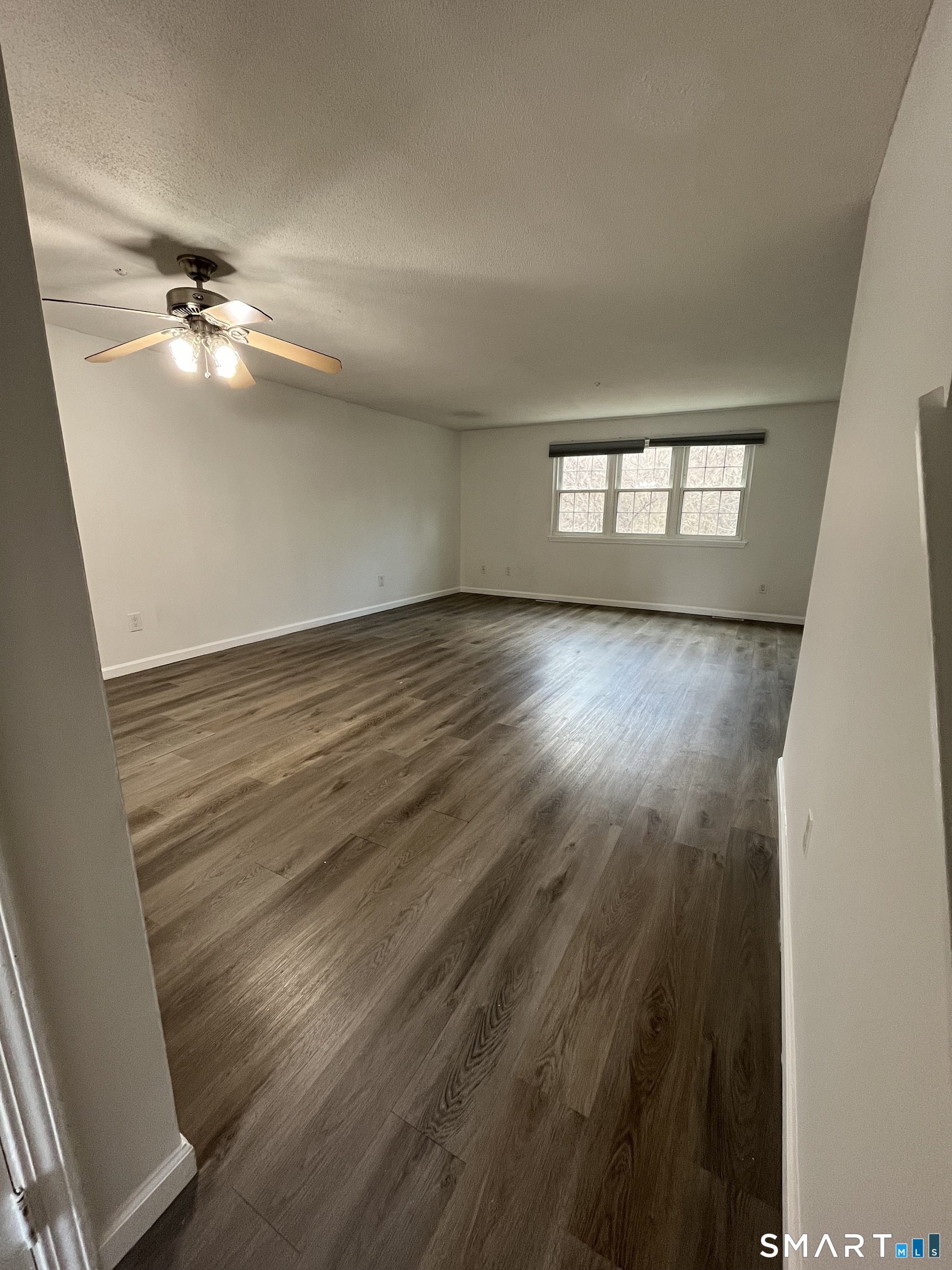 88 East Gate Lane, Unit 88 Hamden, CT 06514 - Photo 28 of 62 wooden floor in an empty room with a window