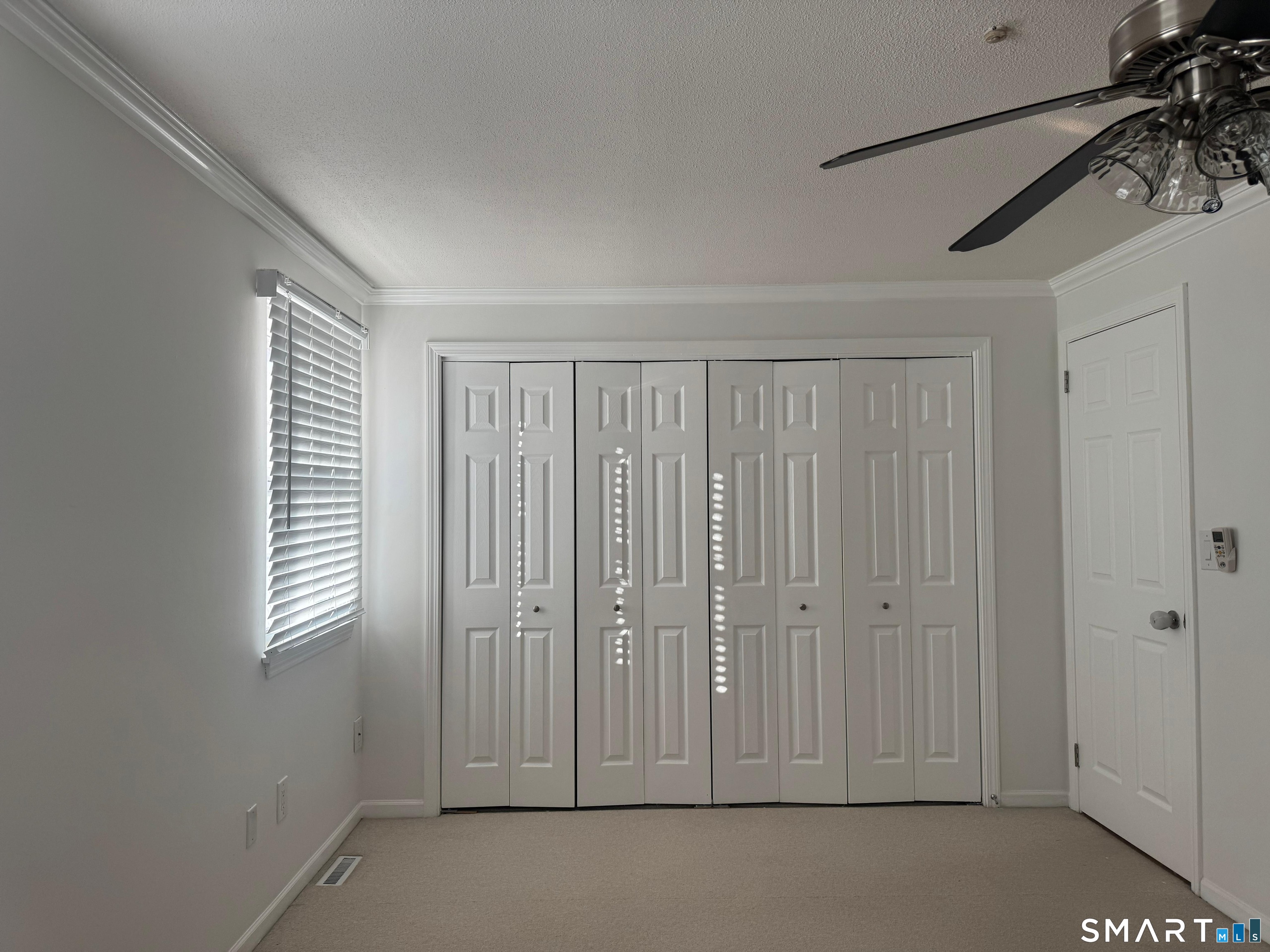 88 East Gate Lane, Unit 88 Hamden, CT 06514 - Photo 30 of 62 a view of a room with an empty space and a window