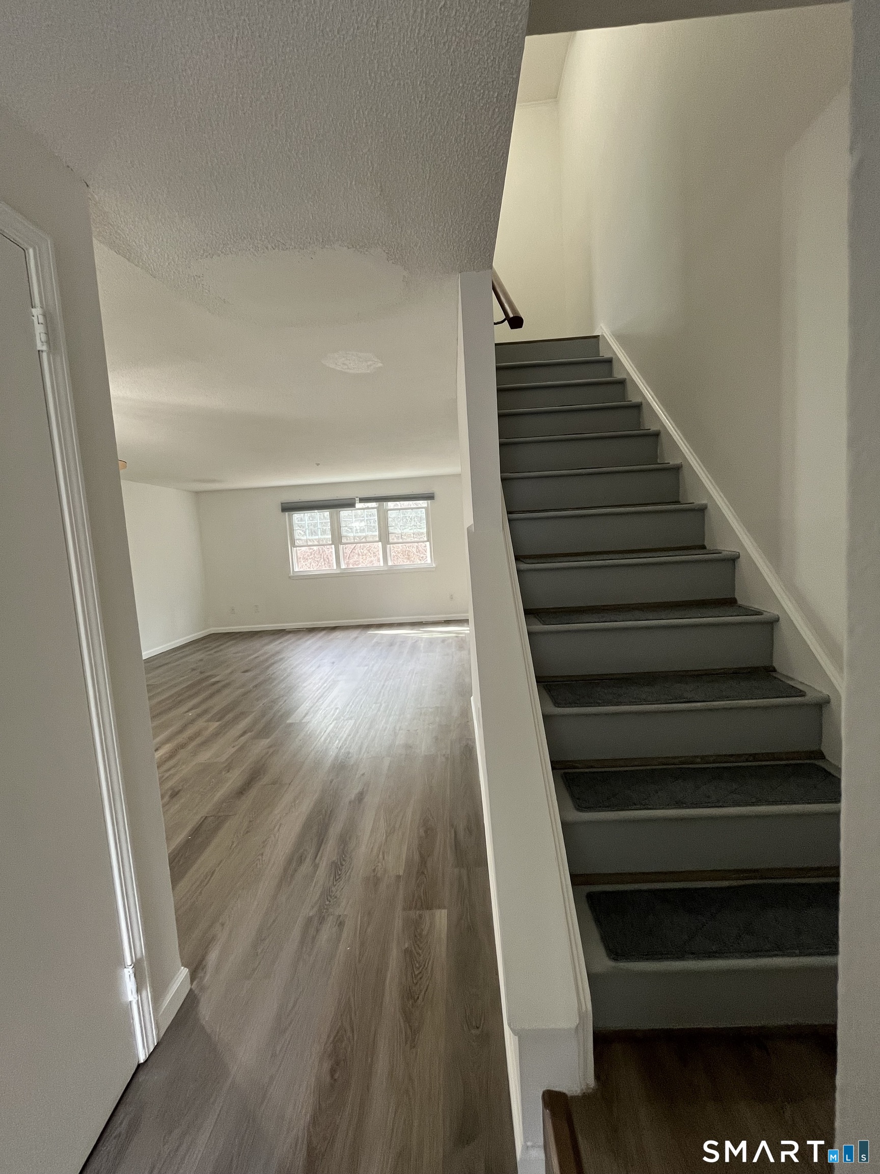 88 East Gate Lane, Unit 88 Hamden, CT 06514 - Photo 40 of 62 a view of entryway and hall with wooden floor