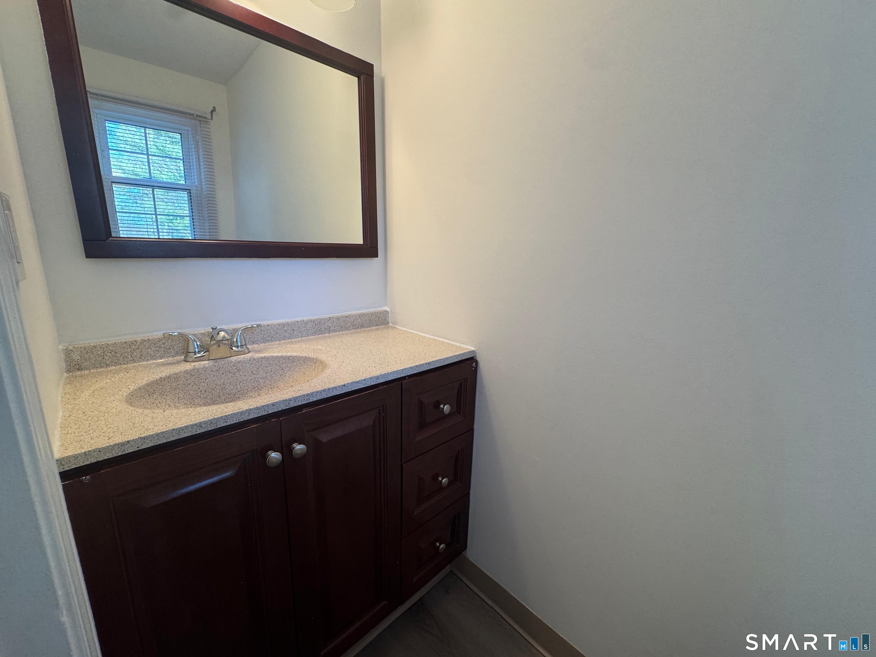 88 East Gate Lane, Unit 88 Hamden, CT 06514 - Photo 41 of 62 a bathroom with a sink and a mirror