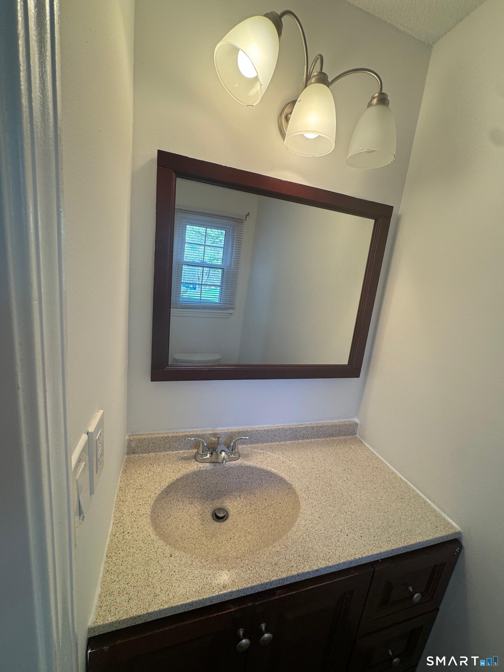 88 East Gate Lane, Unit 88 Hamden, CT 06514 - Photo 42 of 62 a bathroom with a sink and a mirror
