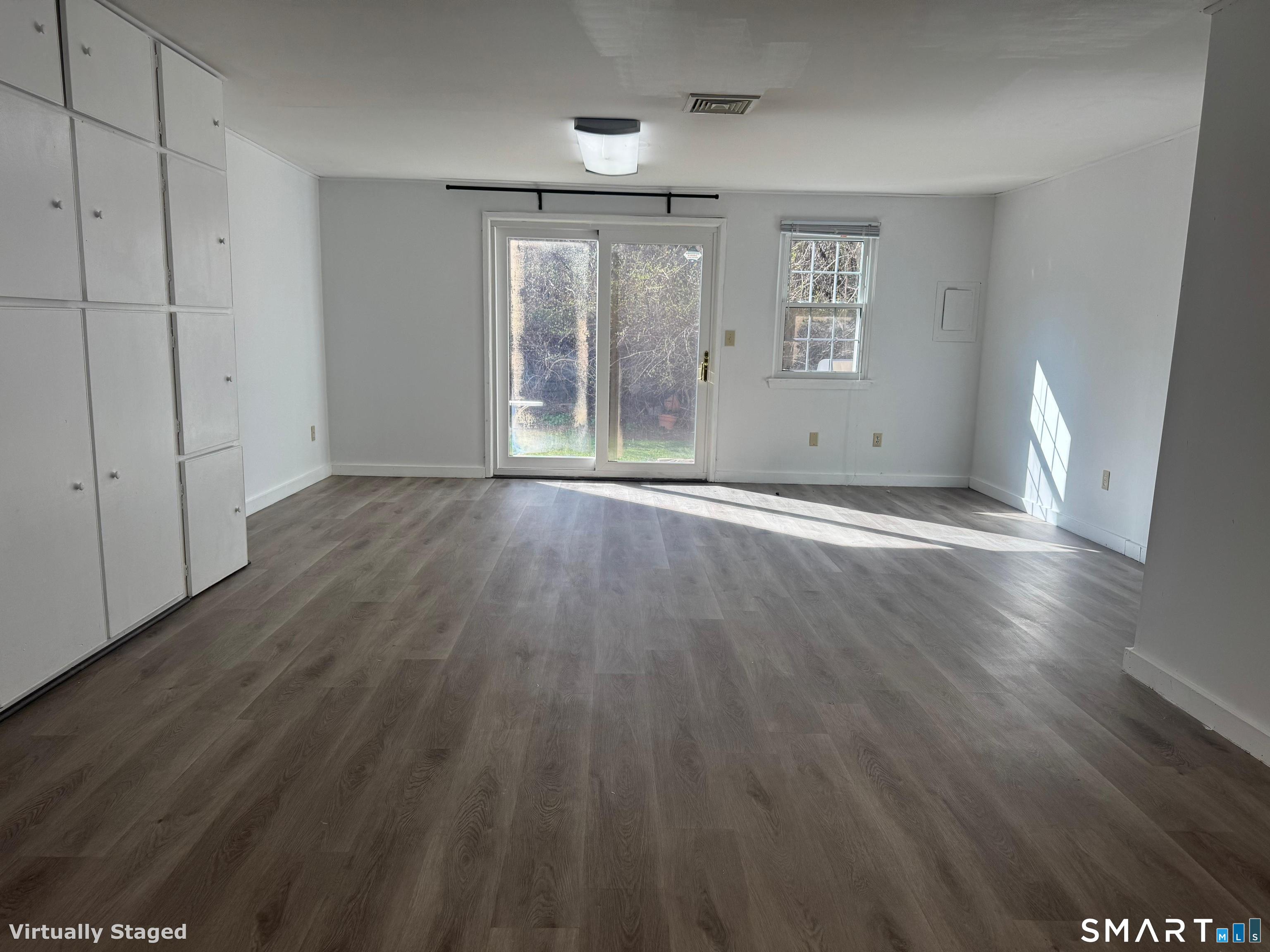 88 East Gate Lane, Unit 88 Hamden, CT 06514 - Photo 46 of 62 wooden floor in an empty room with a window