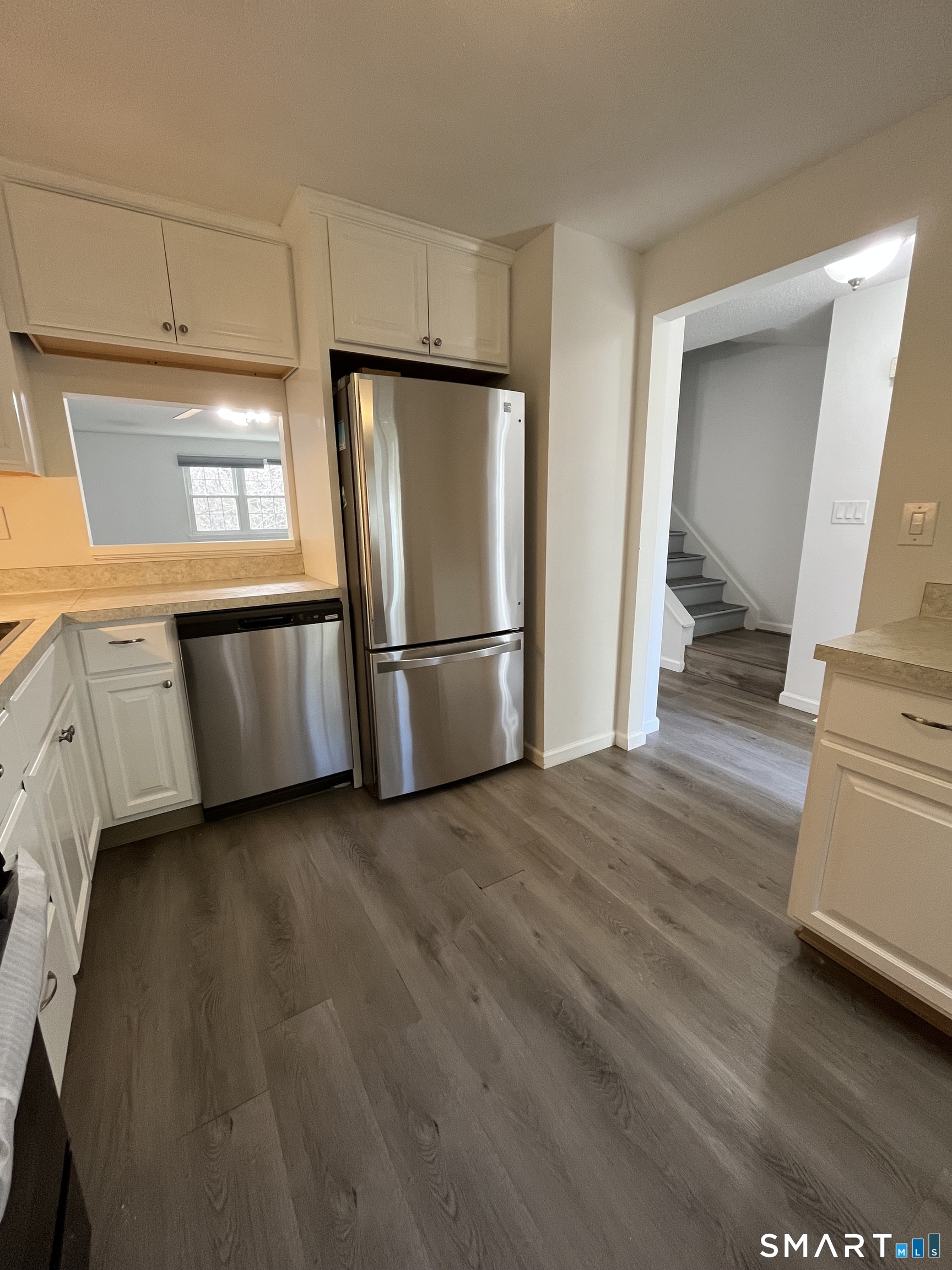 88 East Gate Lane, Unit 88 Hamden, CT 06514 - Photo 7 of 62 a kitchen with stainless steel appliances granite countertop a refrigerator a sink and a stove