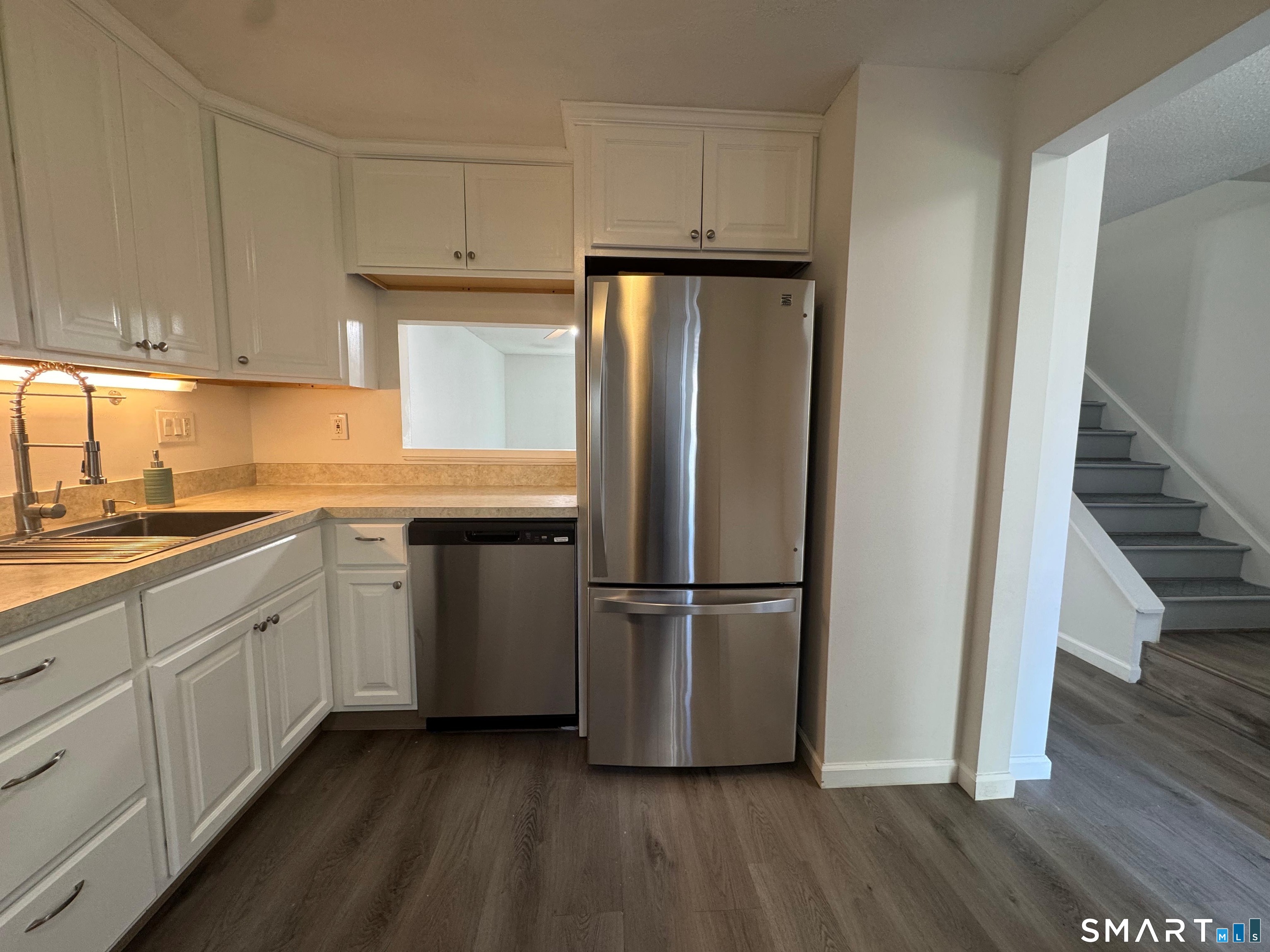 88 East Gate Lane, Unit 88 Hamden, CT 06514 - Photo 8 of 62 a kitchen with stainless steel appliances granite countertop a refrigerator and a stove top oven