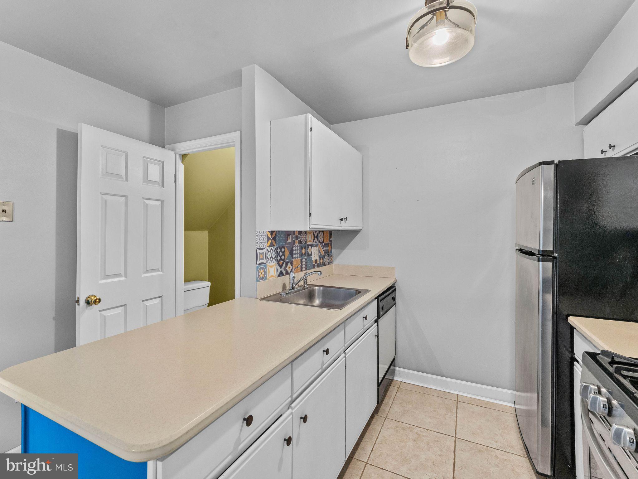 439 Glassboro Road Woodbury Heights, NJ 08097 - Photo 11 of 22 a kitchen with a sink appliances and cabinets