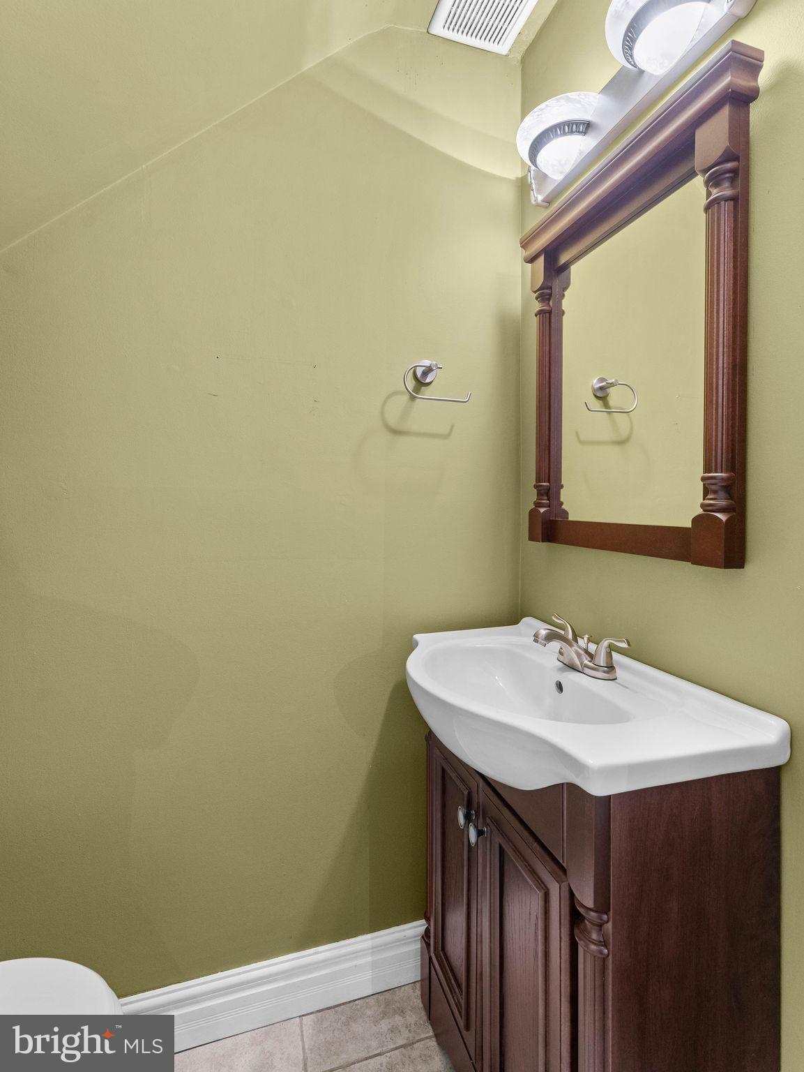 439 Glassboro Road Woodbury Heights, NJ 08097 - Photo 13 of 22 a bathroom with a sink and a mirror