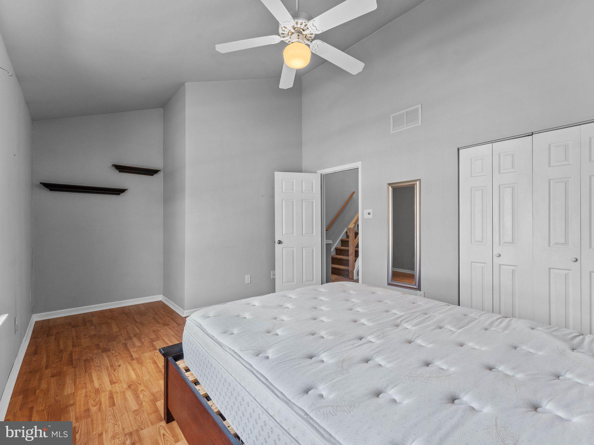 439 Glassboro Road Woodbury Heights, NJ 08097 - Photo 15 of 22 a bedroom with a bed and a chandelier