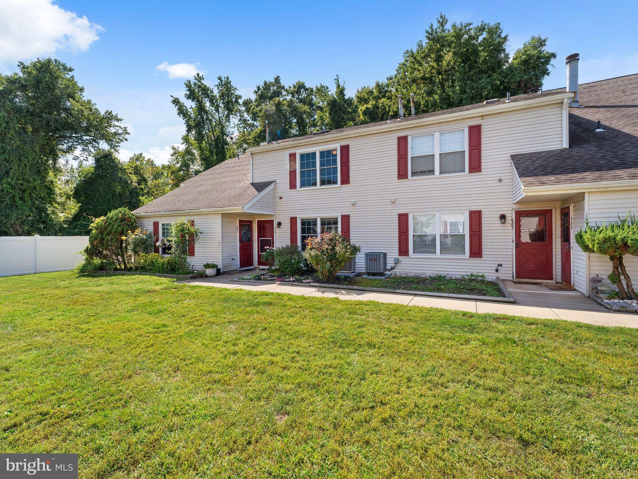 439 Glassboro Road Woodbury Heights, NJ 08097 - Photo 3 of 22 a front view of house with yard and trees in the background