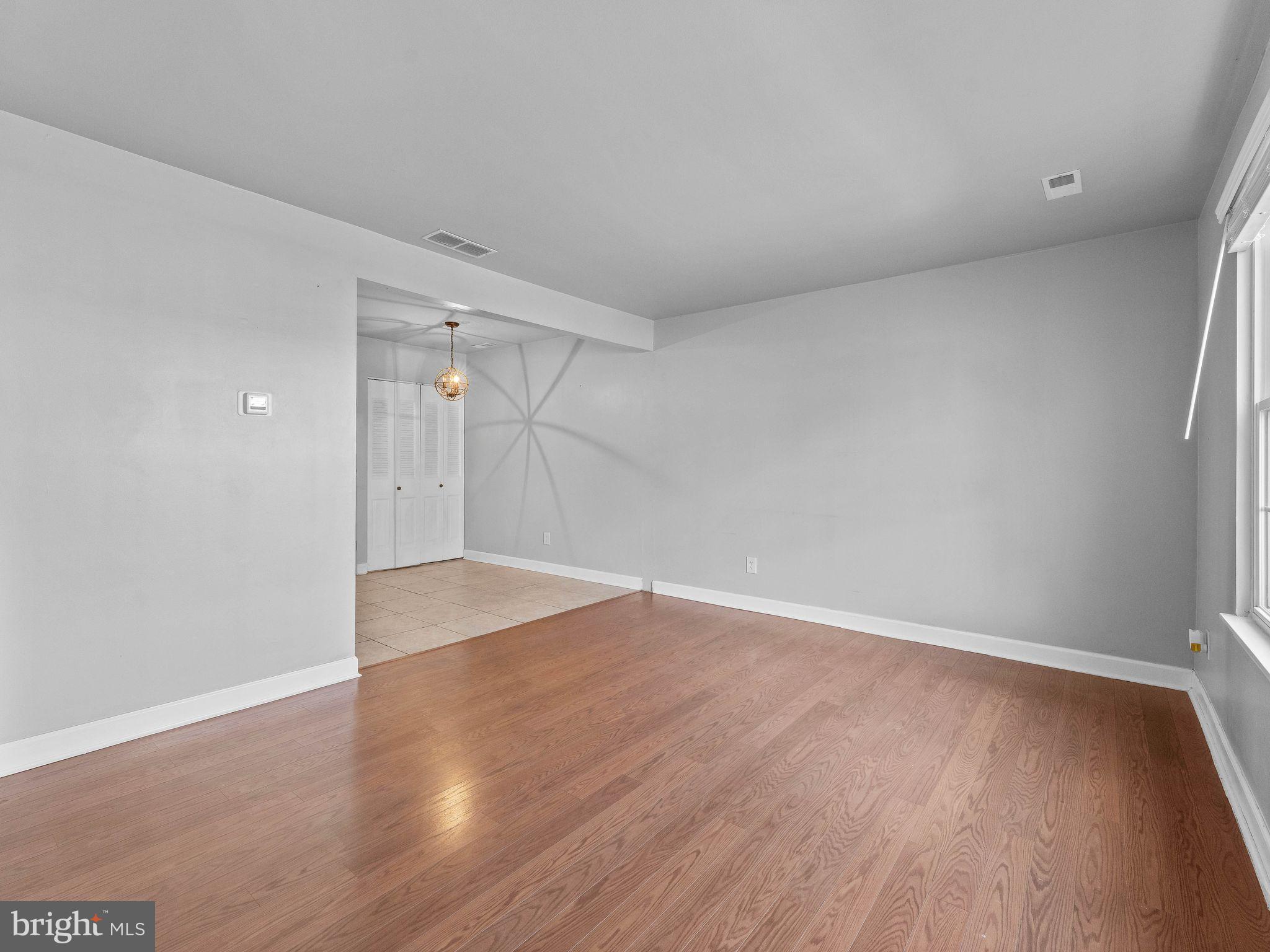 439 Glassboro Road Woodbury Heights, NJ 08097 - Photo 5 of 22 a view of an empty room with wooden floor