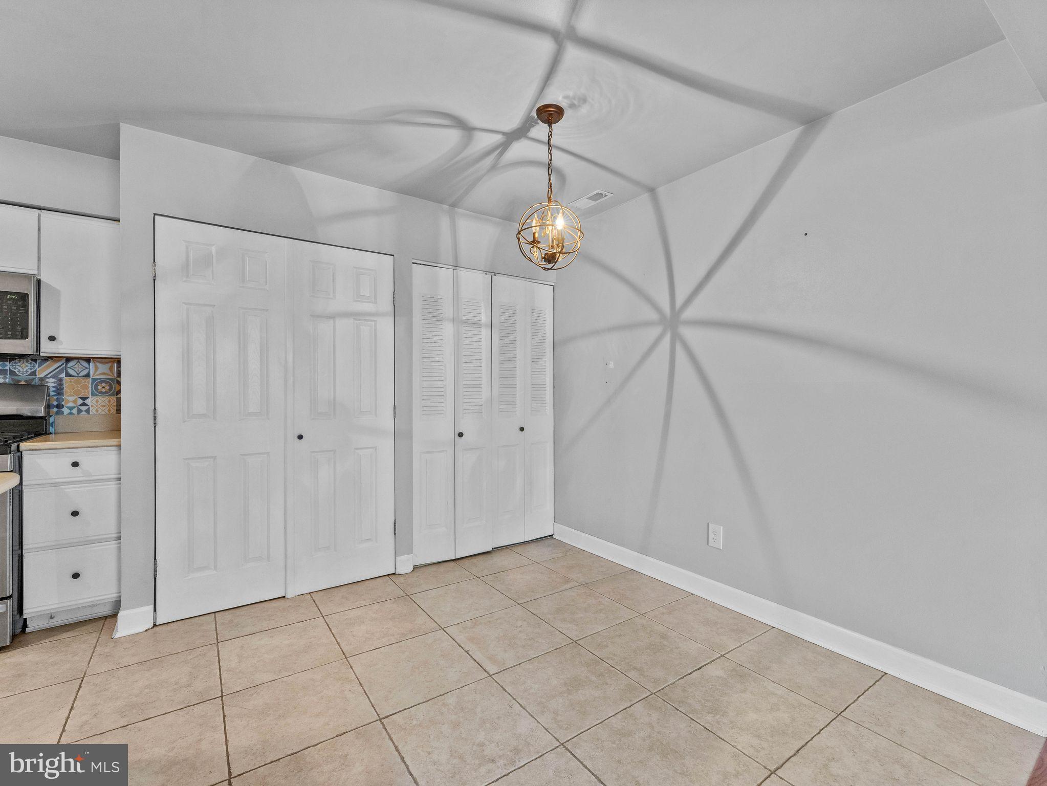 439 Glassboro Road Woodbury Heights, NJ 08097 - Photo 8 of 22 a view of a storage & utility room with wooden floor