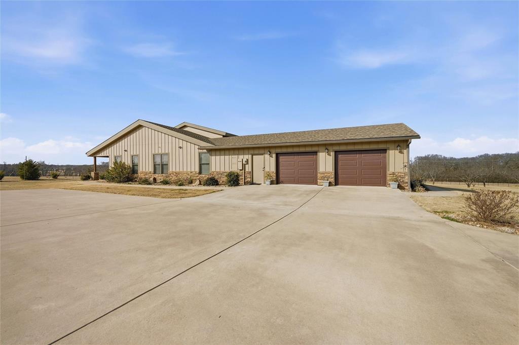 1000 Swindle Road Howe, TX 75459 - Photo 33 of 40 a front view of a house with a yard and garage