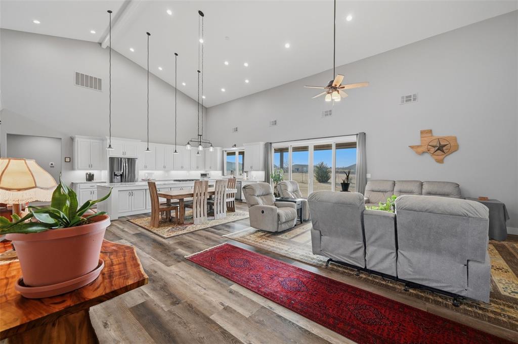 1000 Swindle Road Howe, TX 75459 - Photo 7 of 40 a living room with furniture a window and a chandelier