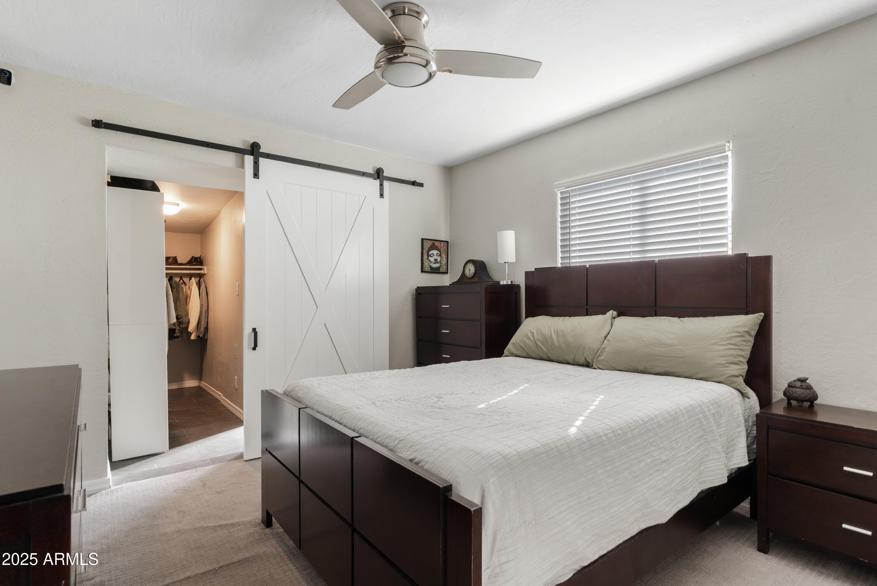 2147 West Osborn Road Phoenix, AZ 85015 - Photo 12 of 29 a bedroom with a bed and a mirror
