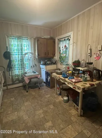 a room with furniture a window and a table