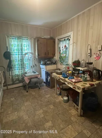 a room with furniture a window and a table