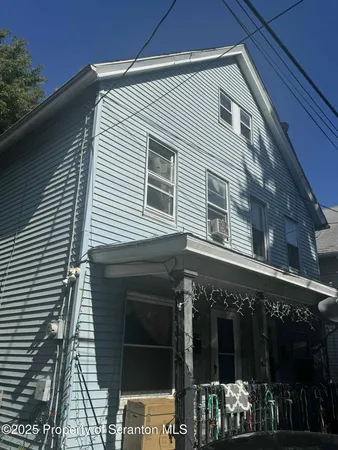 a front view of a house with glass windows