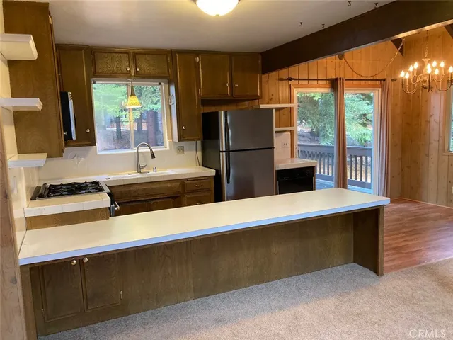 a view of fireplace and wooden floor