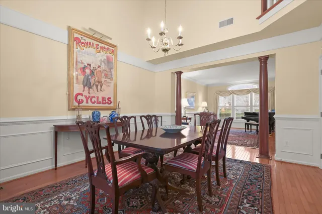 a large kitchen with a table and chairs